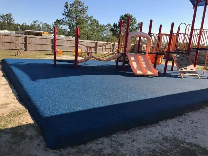 pour-in-place rubber surface on playground
