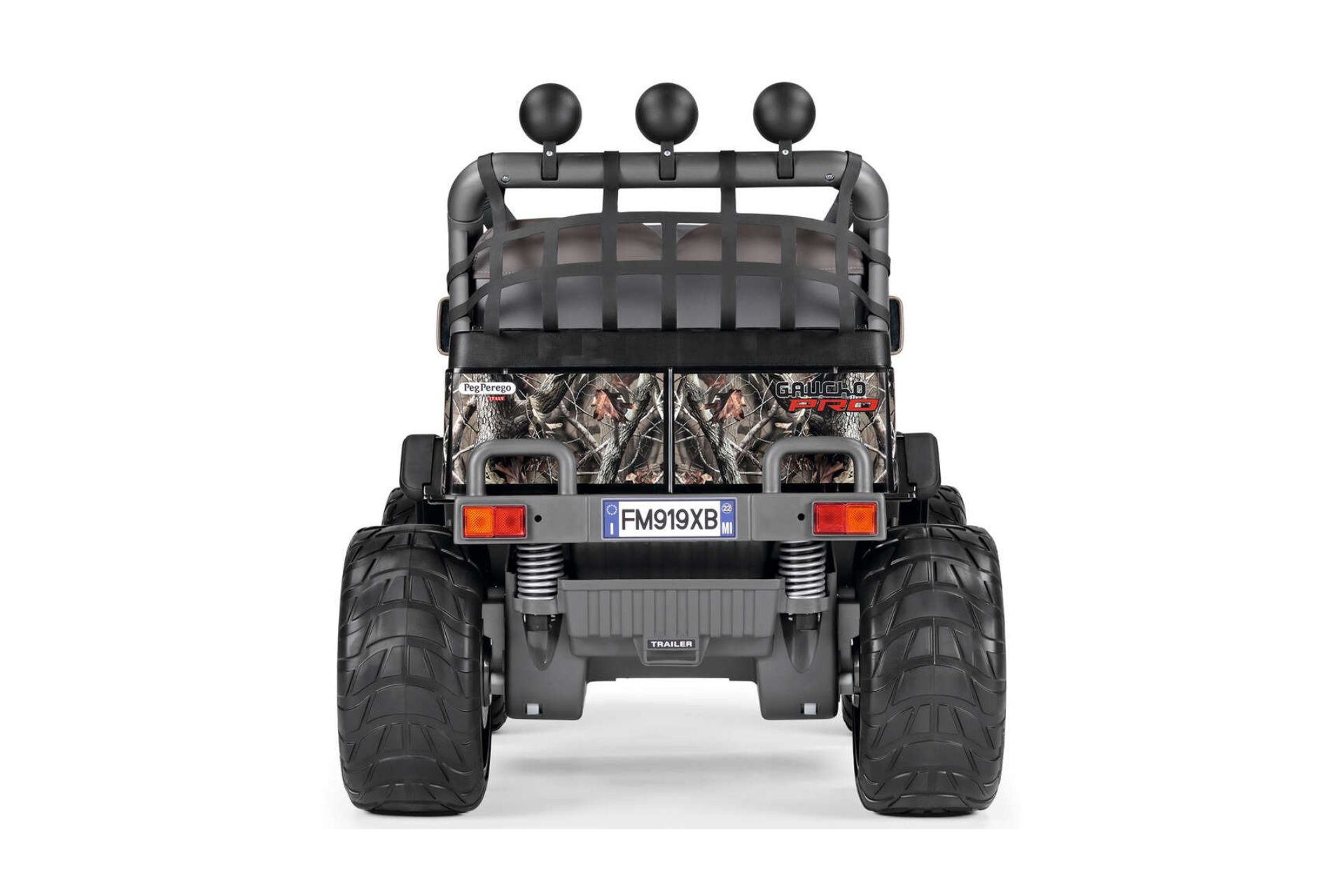 Rear view of two-seater off-road ride-on vehicle with large tires, camouflage panels, safety netting, and rear shock absorbers