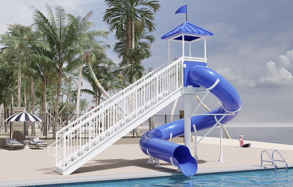 Bridalveil Falls Water Slide with blue 360-degree turn, white freestanding stairs, and splashdown pool by palm trees
