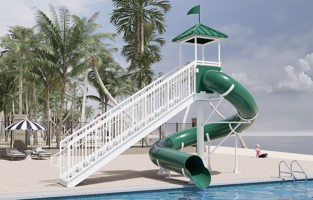 Freestanding green water slide with 360-degree turn, white stairs, safety railings, and shaded top platform by poolside