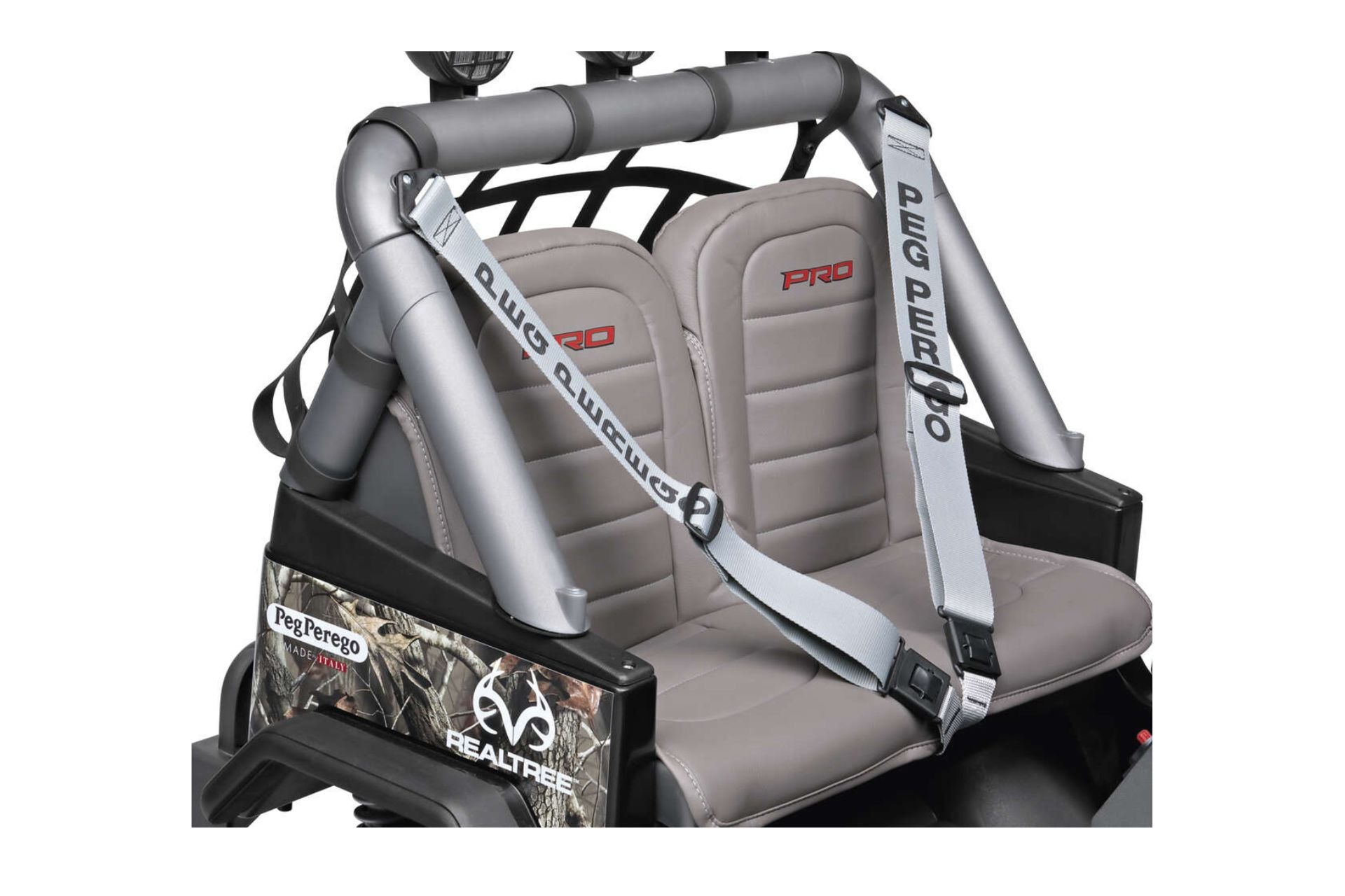 Two-seater ride-on vehicle with gray padded seats, safety belts, and Realtree camo side panels.