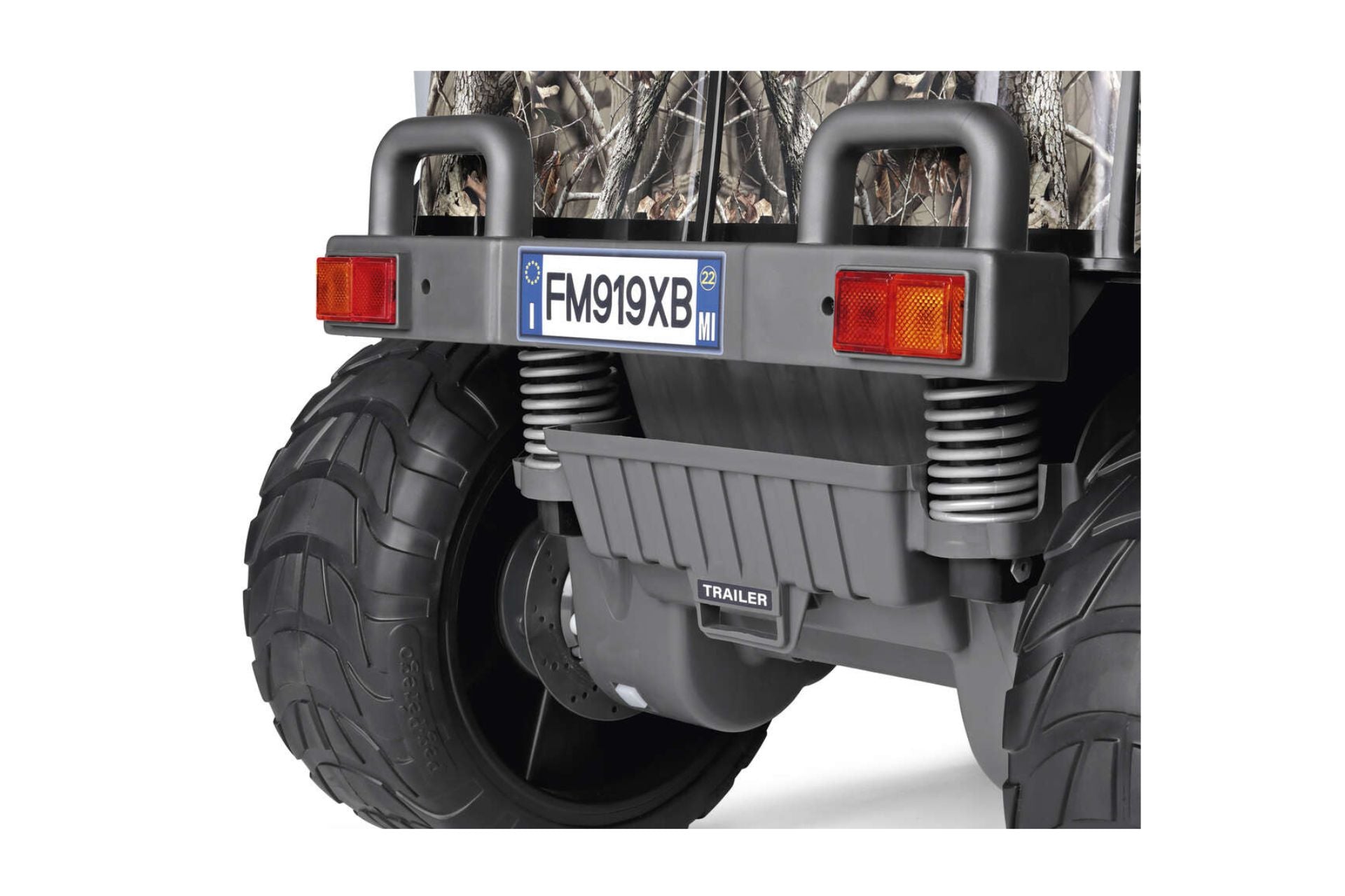 Rear view of two-seater off-road ride-on vehicle with large tires, rear suspension springs, and trailer hitch attachment