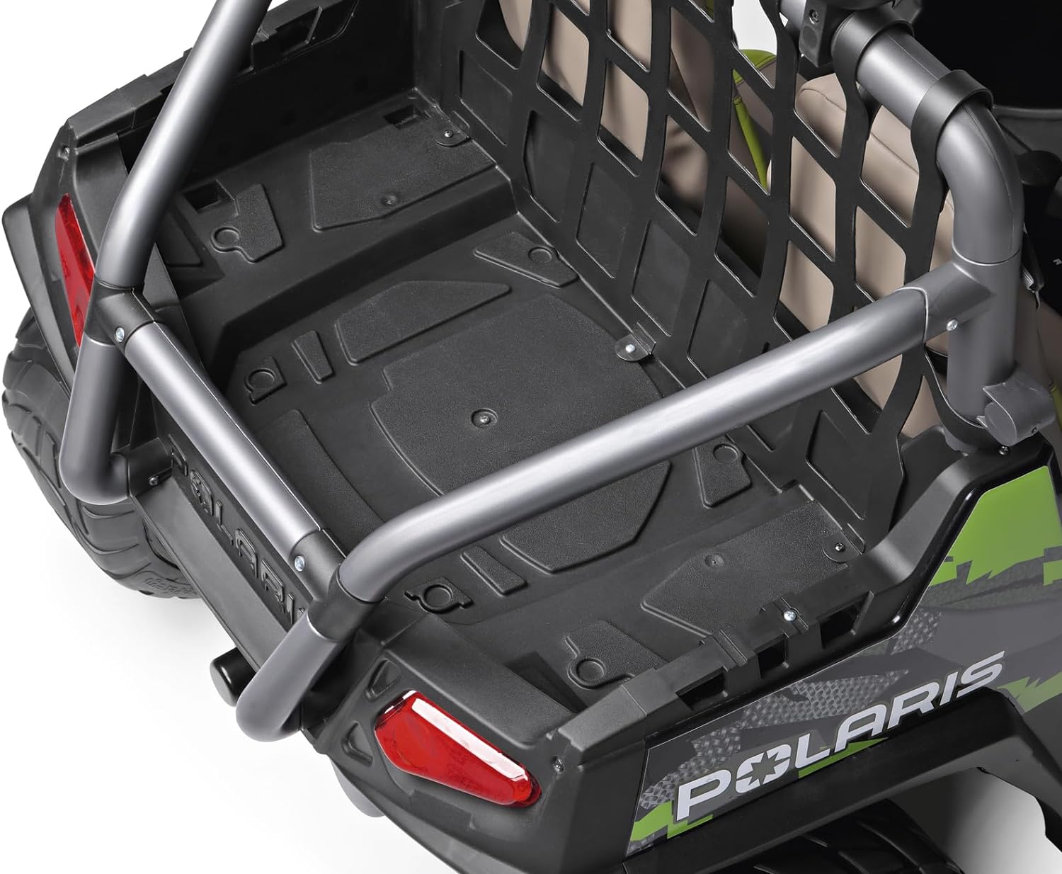 Rear cargo area of green and black Polaris RZR PRO ride-on vehicle with safety net and red taillights