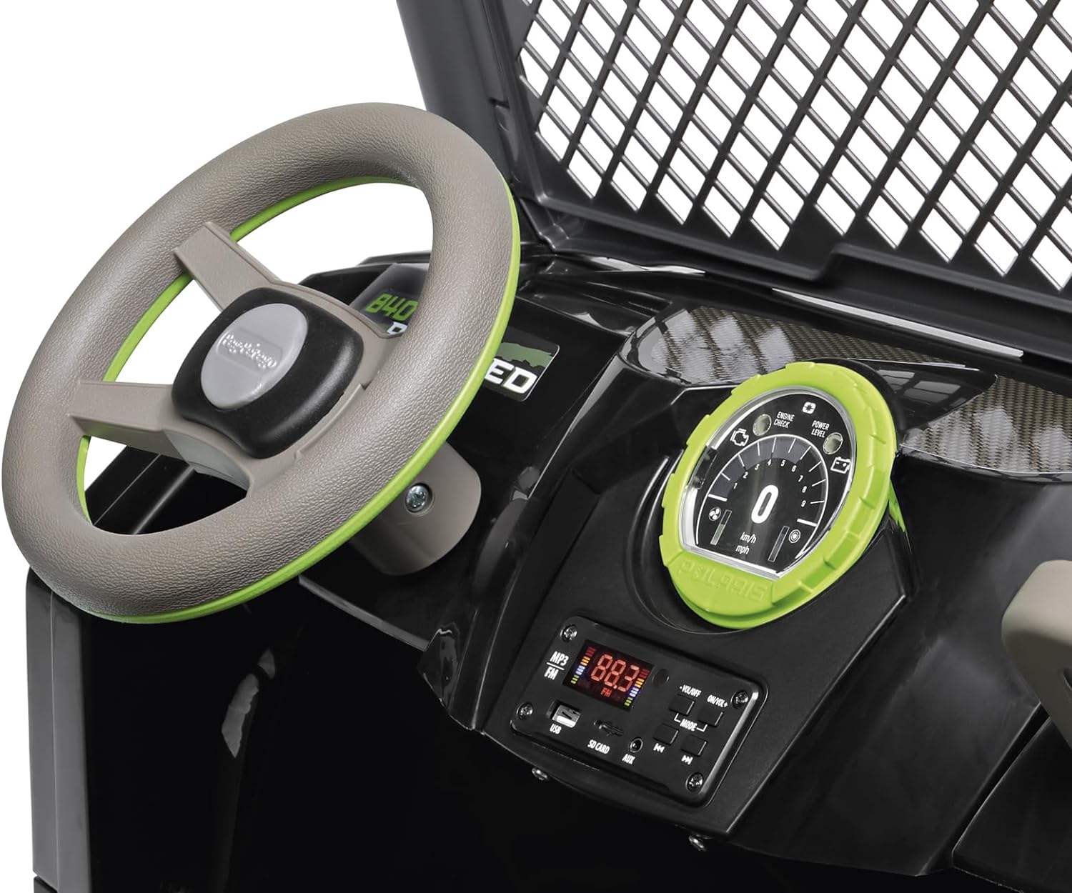 Kids' ride-on vehicle dashboard with green-accented steering wheel, digital speedometer, and media control panel including FM radio and USB port
