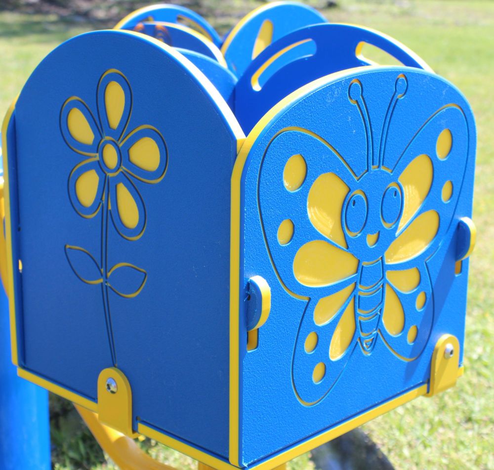 Blue and yellow four-seat merry-go-round with butterfly and flower panel designs, outdoor playground equipment