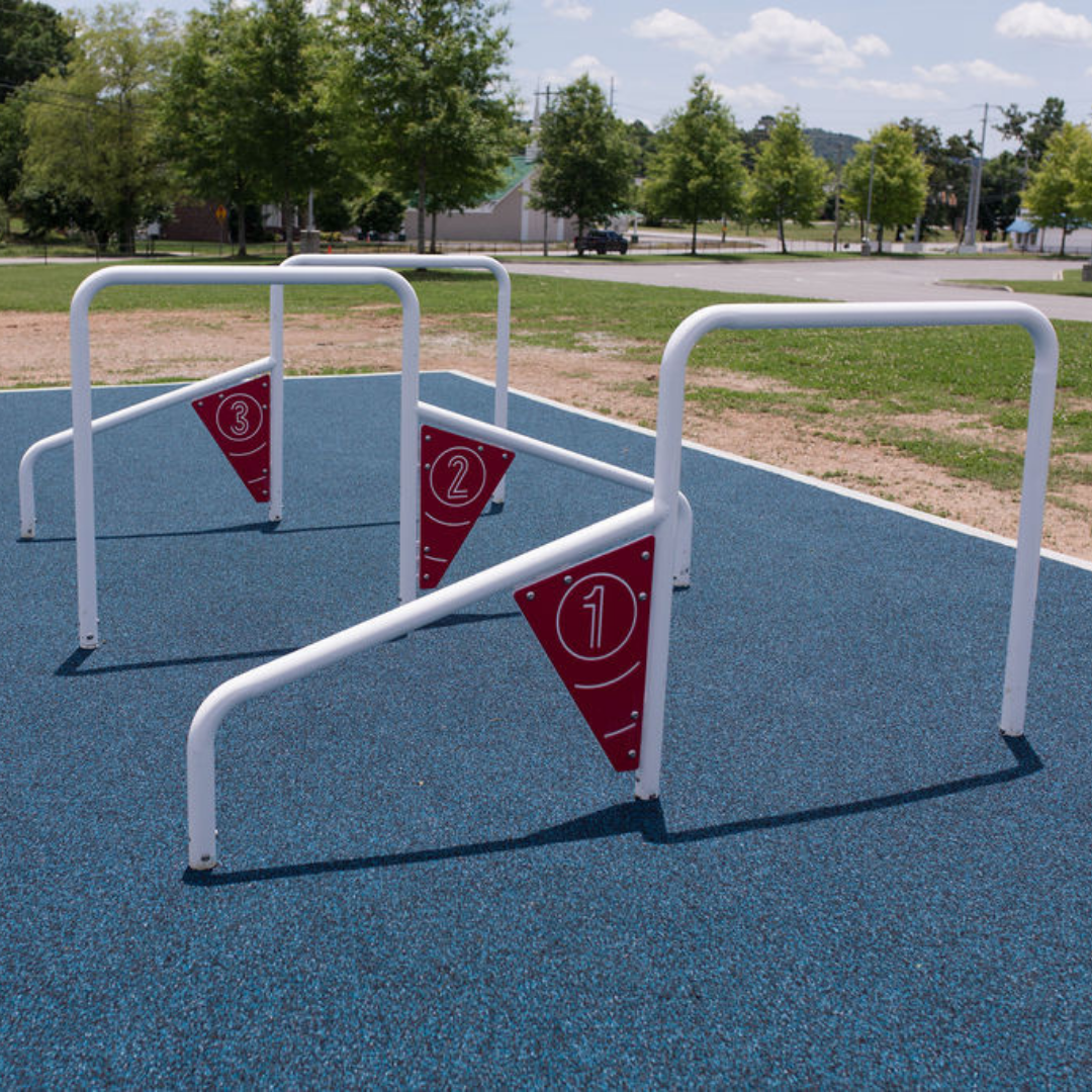 ActionFit Kids Challenge Zone outdoor workout equipment with numbered bars on blue safety surface for jumping and ducking exercises