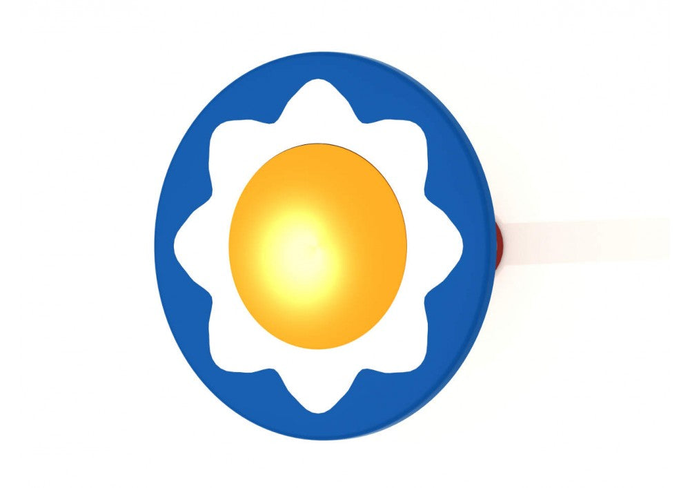 Overhead view of a blue steel playground drum with white flower-shaped design and yellow center, surrounded by polyethylene petals