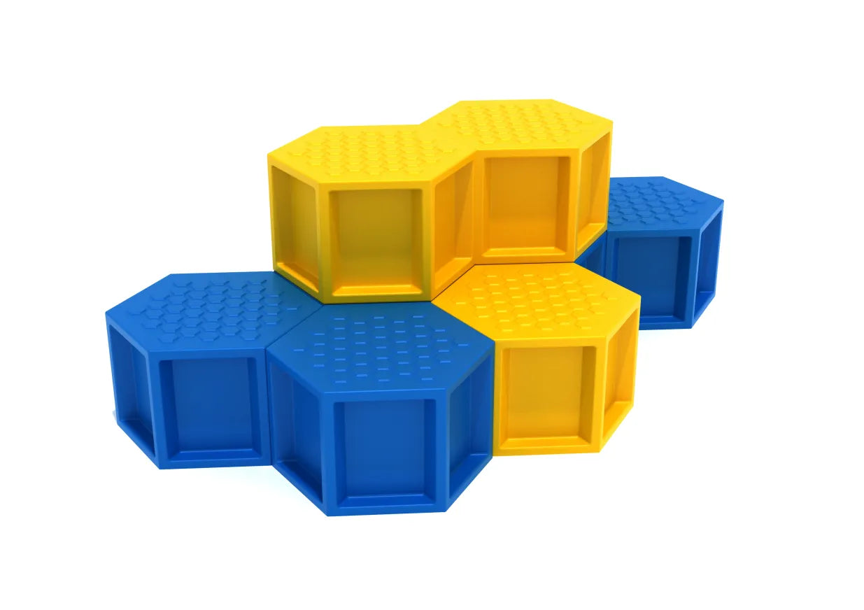 Stacked blue and yellow hexagonal climbing pods with textured non-slip surfaces for playground balance and coordination