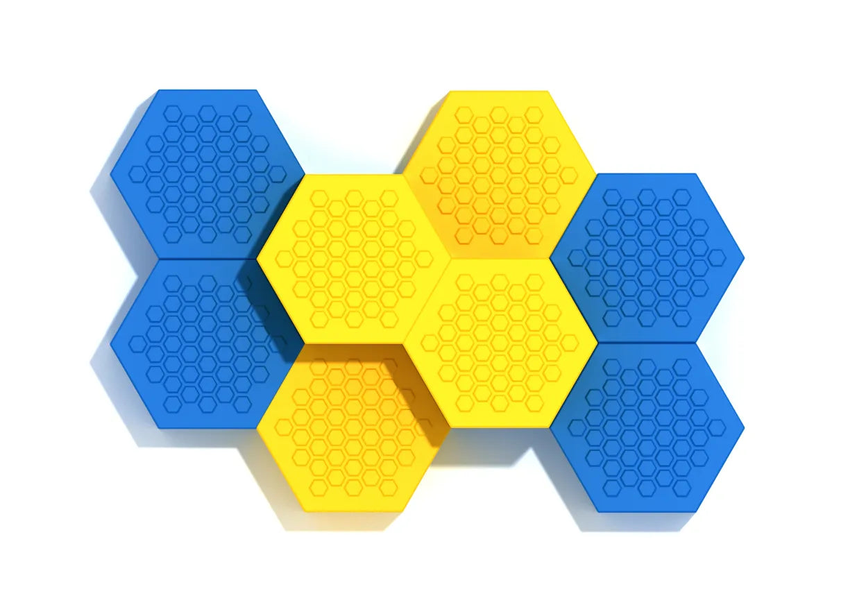 Overhead view of blue and yellow hexagonal climbing pods with textured honeycomb patterns for playground coordination and balance