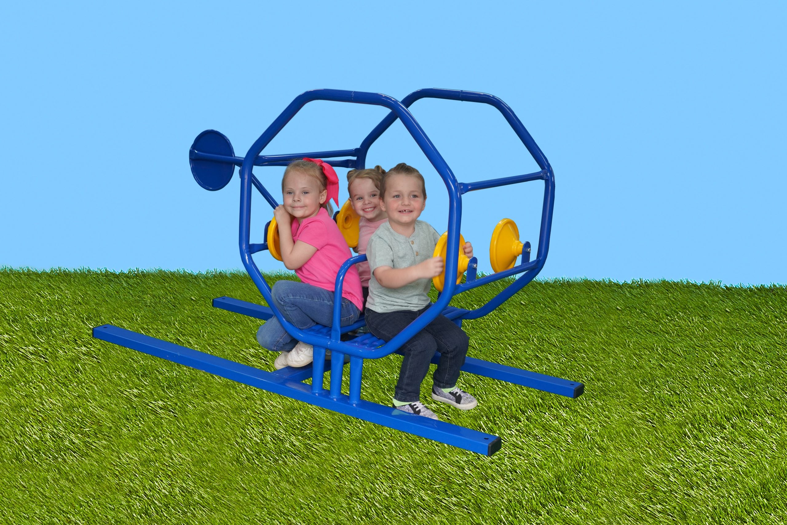 Blue metal helicopter play structure with four yellow steering wheels and three children seated on artificial grass