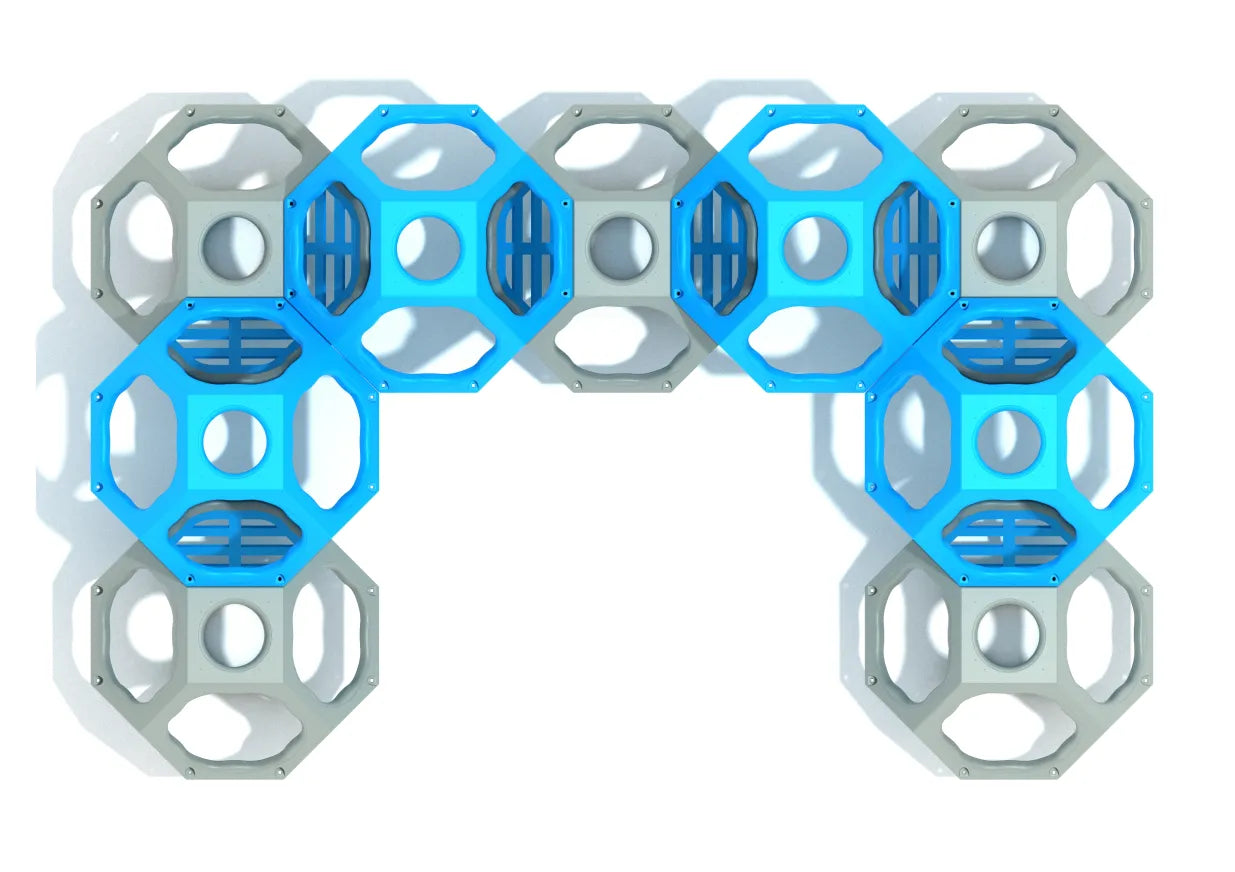 Overhead view of modular climbing cube with blue and gray geometric pods and open-air pathways for active play