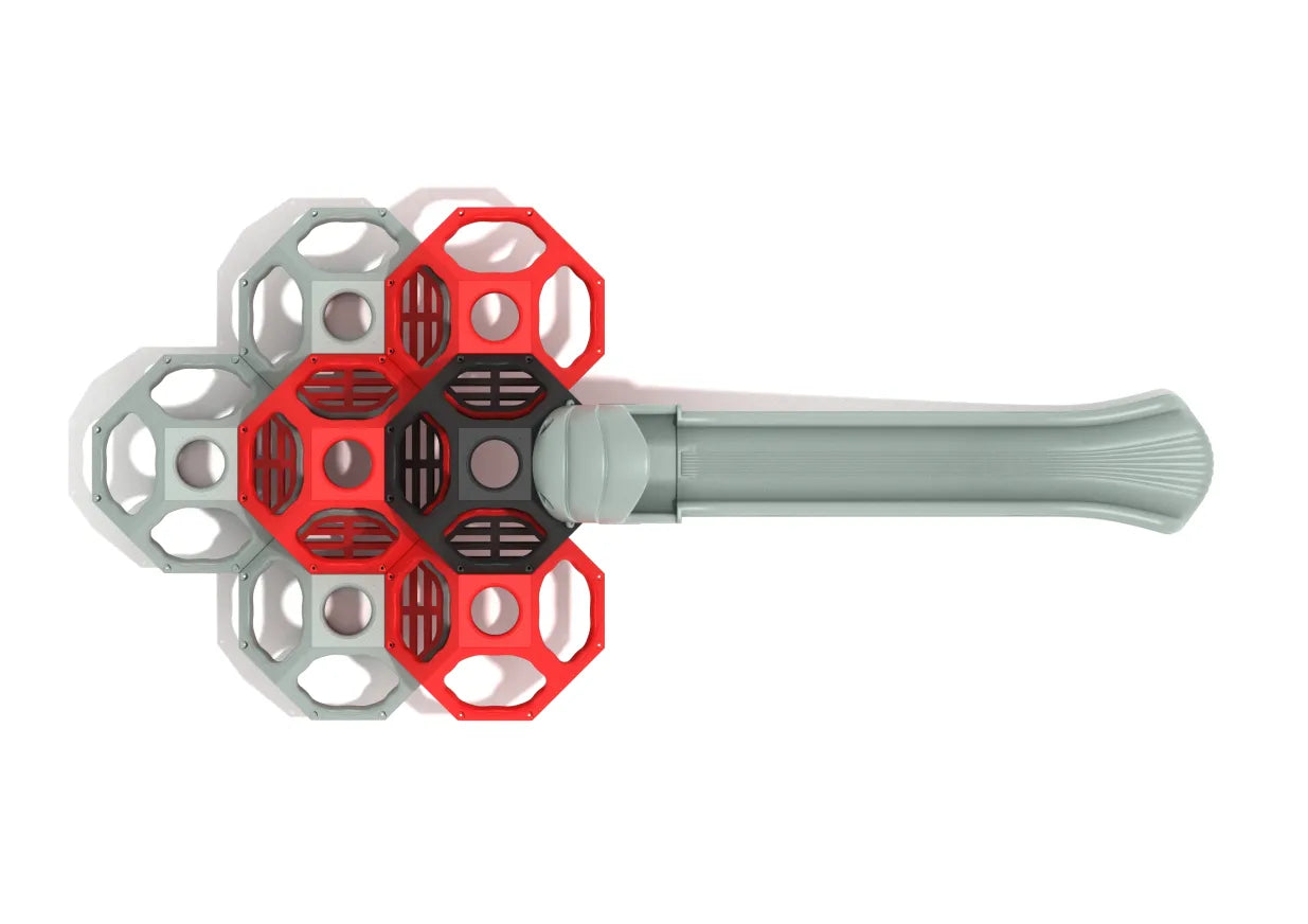 Overhead view of modular climbing cube with red, charcoal, and gray geometric pods connected to a smooth wave slide