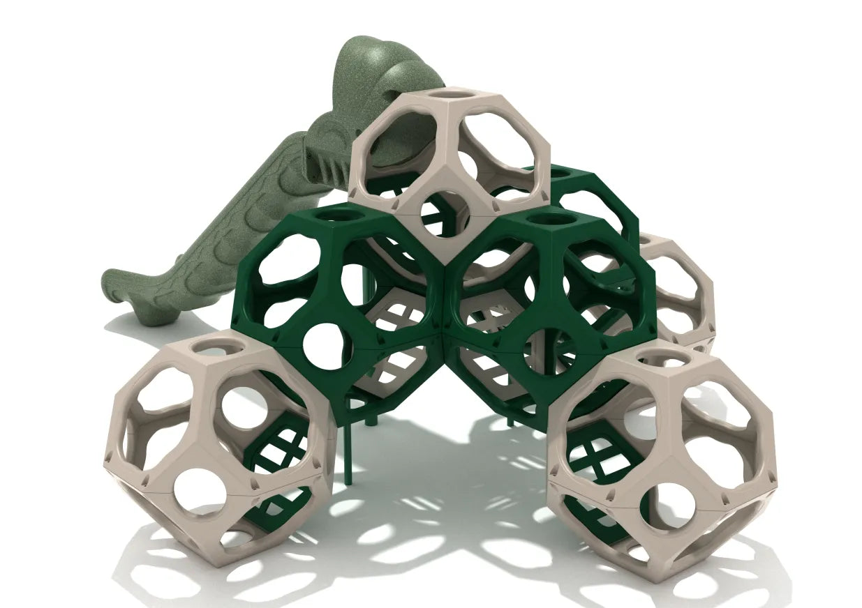 Polyhedral climbing structure with tan and green geometric shapes and a textured green wave slide.