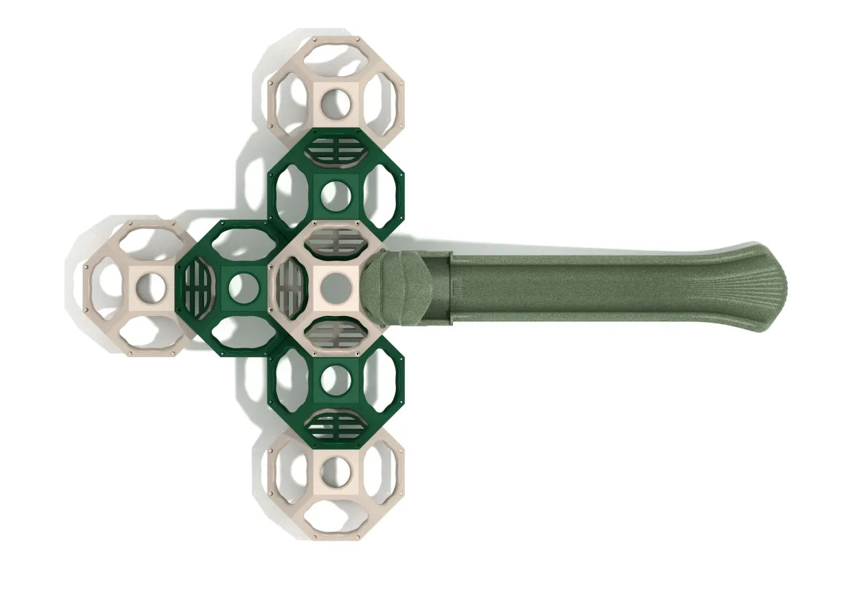 Overhead view of tan and green polyhedral climbing cubes with open passages and a green wave slide in a geometric playground structure