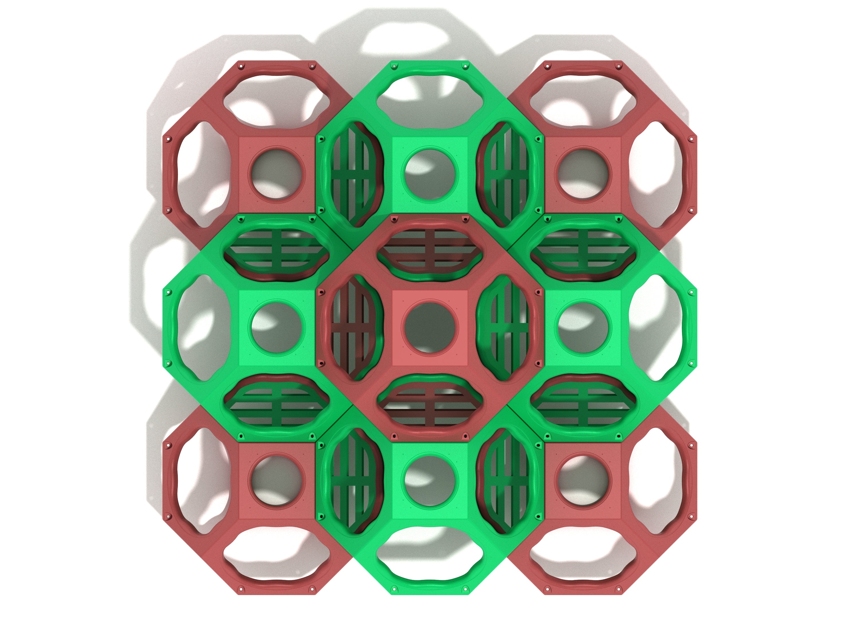 Overhead view of geometric climbing cube with interconnected red and green open-frame pods featuring circular and slatted openings