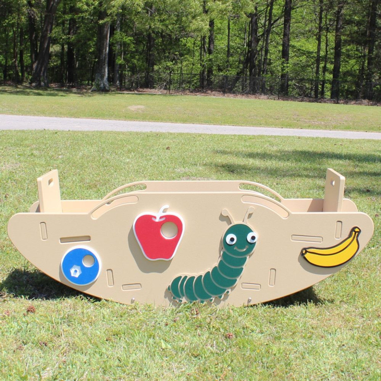 Slayden's Seesaw playground seesaw with beige base featuring caterpillar, red apple, yellow banana, and blue circle figures