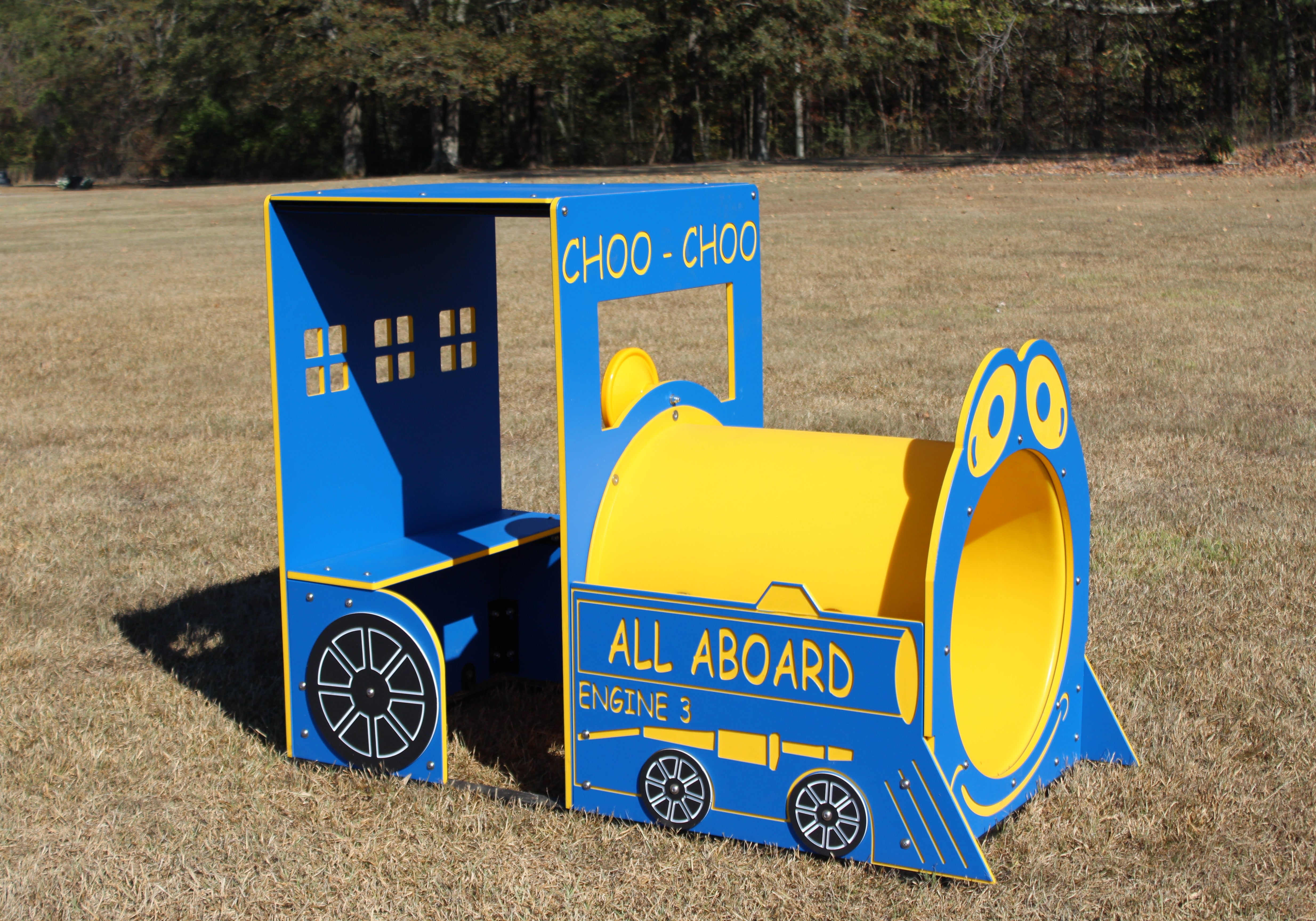 Blue and yellow outdoor play train engine with open cabin, circular front tunnel, and decorative wheel graphics
