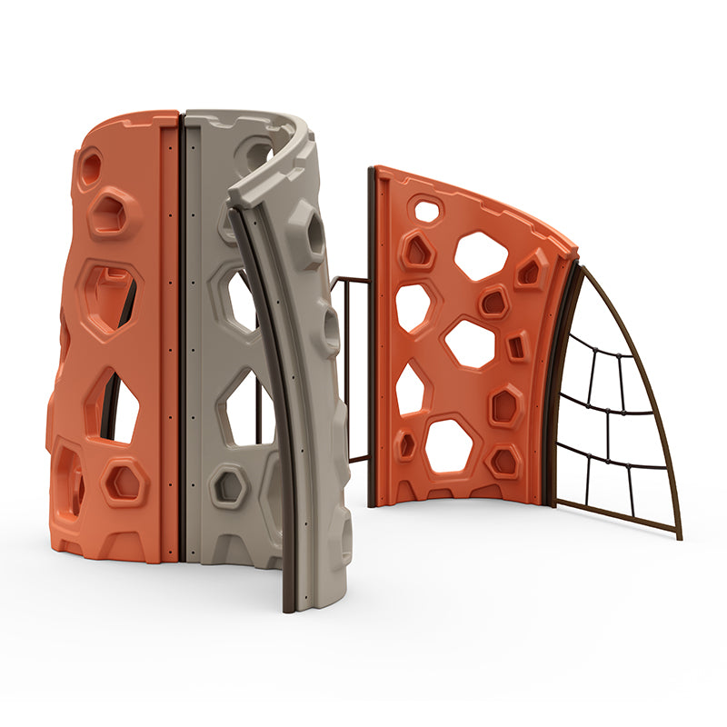 Modular outdoor climbing structure with interconnected panels, geometric cutouts, and orange and gray climbing holds.