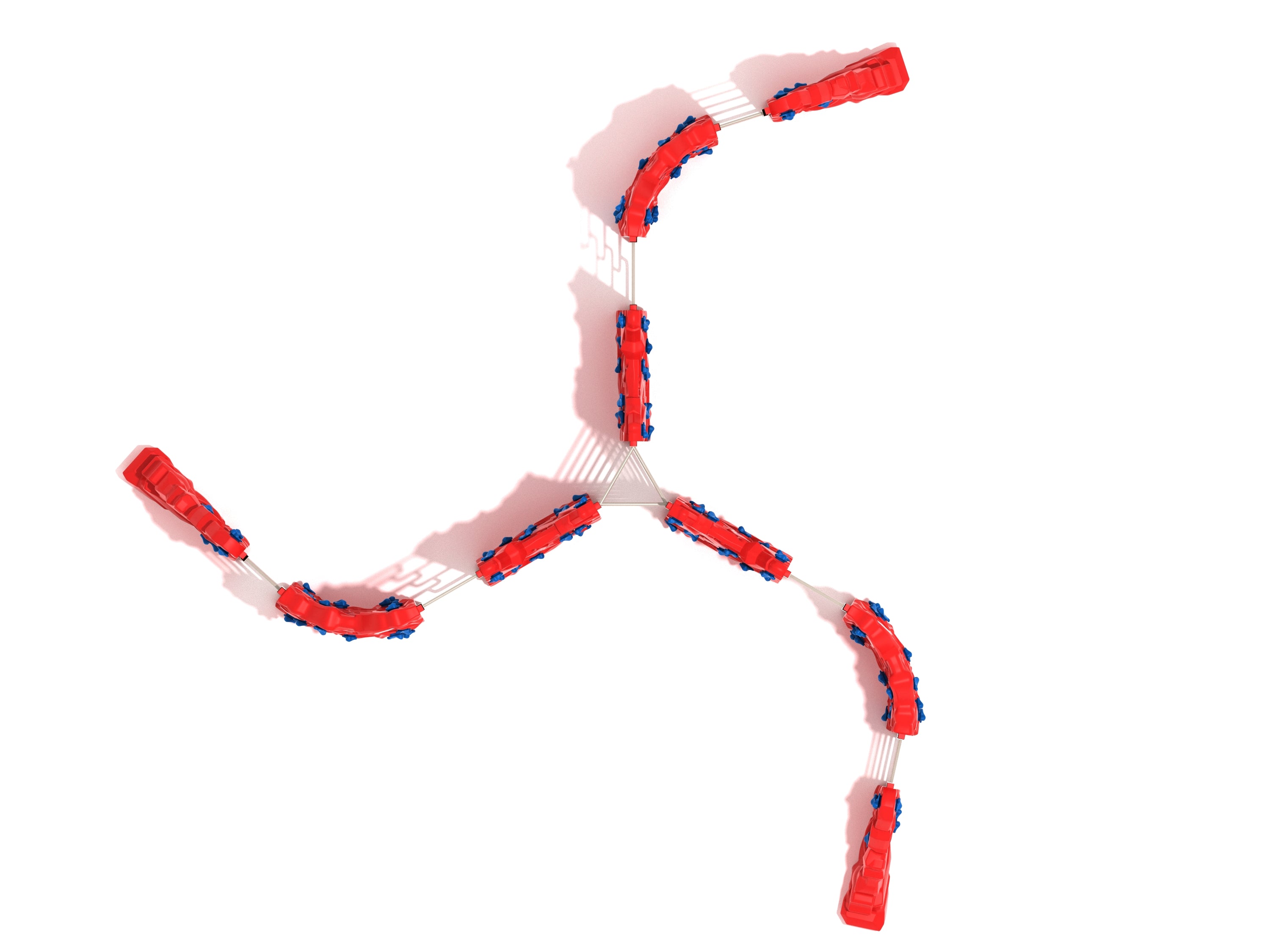 Overhead view of red modular playground climbing structure with blue handholds and connecting ladder sections