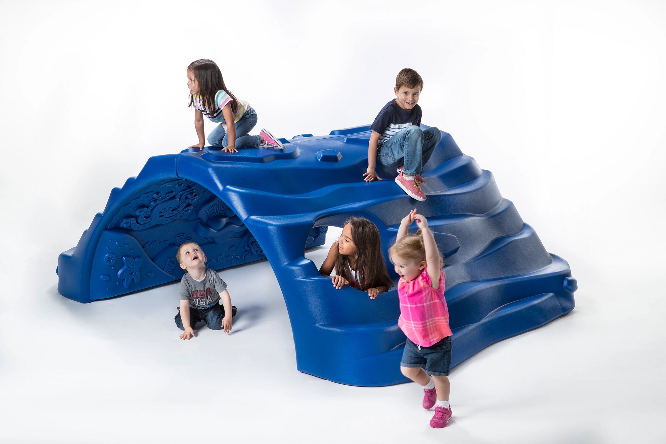 Poseidon's Hideout blue ocean-themed climbing structure with children playing actively on and around it