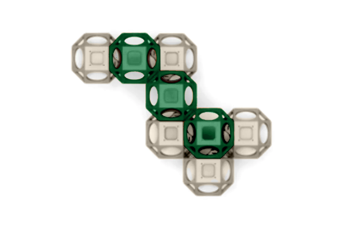 Overhead view of a modular climbing cube with alternating green and tan open-frame panels for playground activity and puzzle play