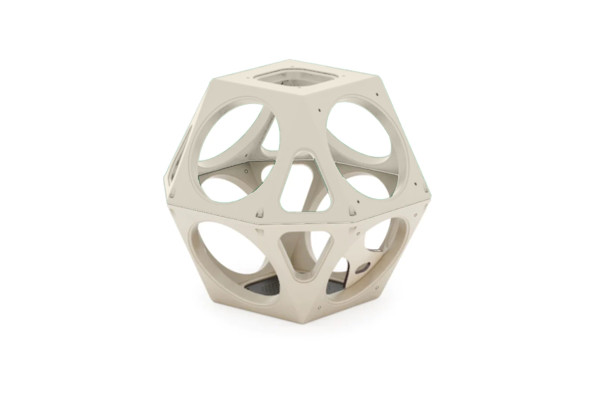 Tan geometric climbing structure with large circular cutouts for play and modular set integration