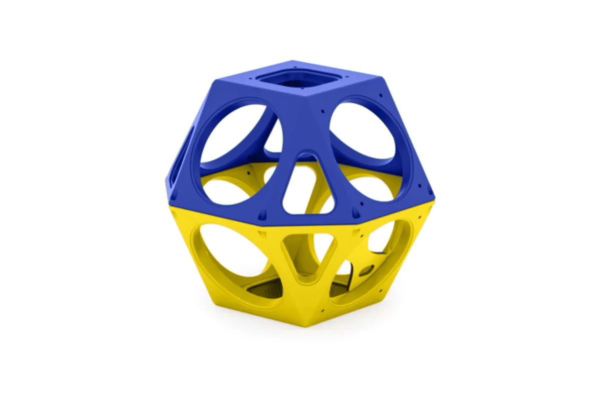 Blue and yellow geometric climbing structure with circular cutouts for playground or standalone use