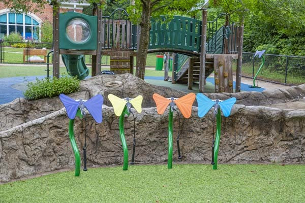 Toddler Butterfly Ensemble outdoor musical park instruments with colorful butterfly-shaped aluminum notes and mallets on green stems