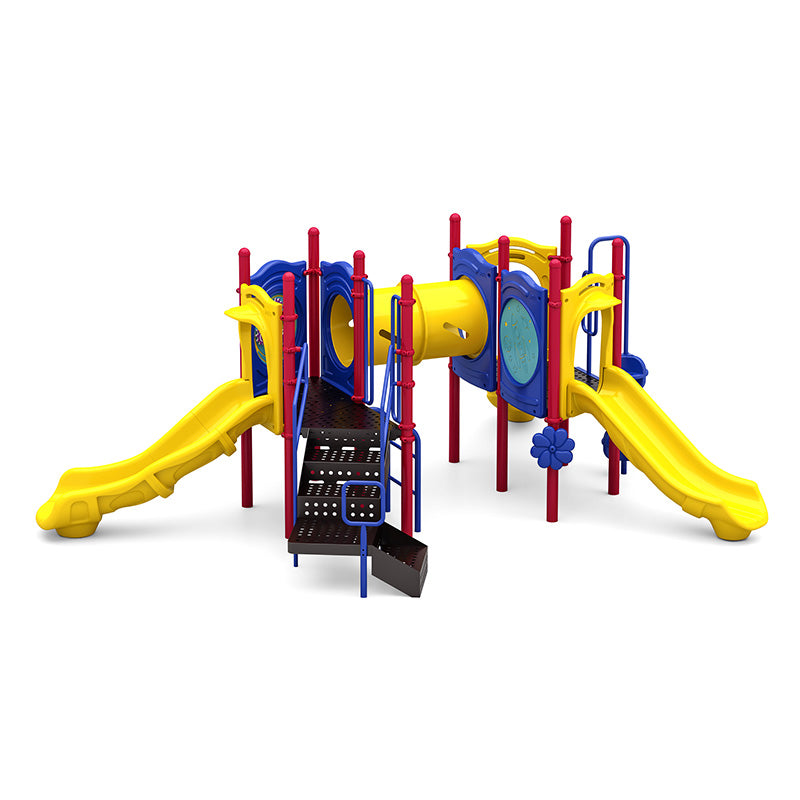 Colorful playground system with two yellow slides, crawl tunnel, climbing platforms, and sensory play panels.