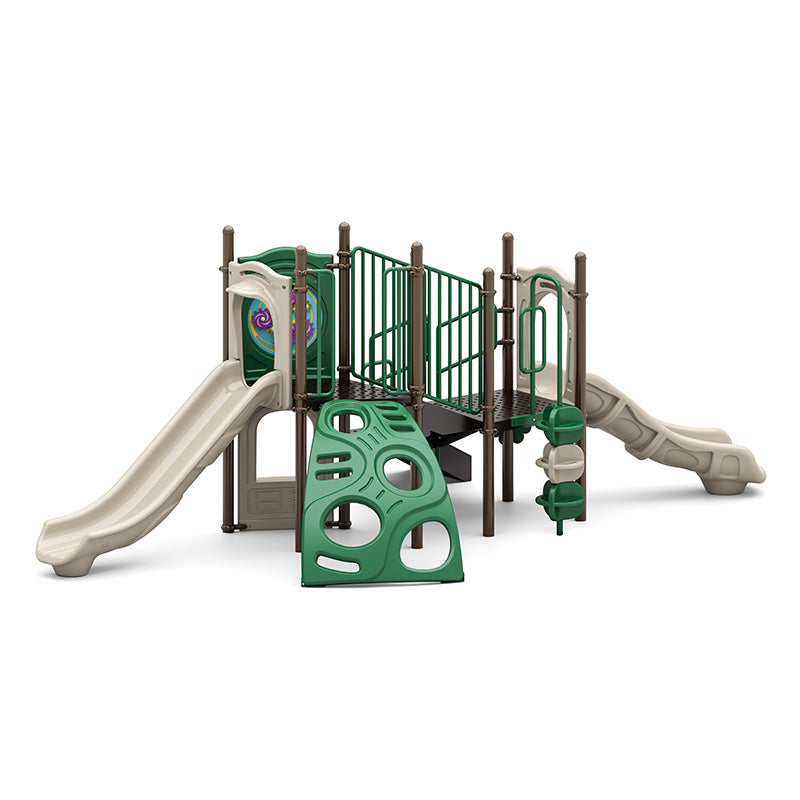 Boulder Dash Playground with green climbing wall, two beige slides, interactive play panels, and ADA transfer station in natural tones