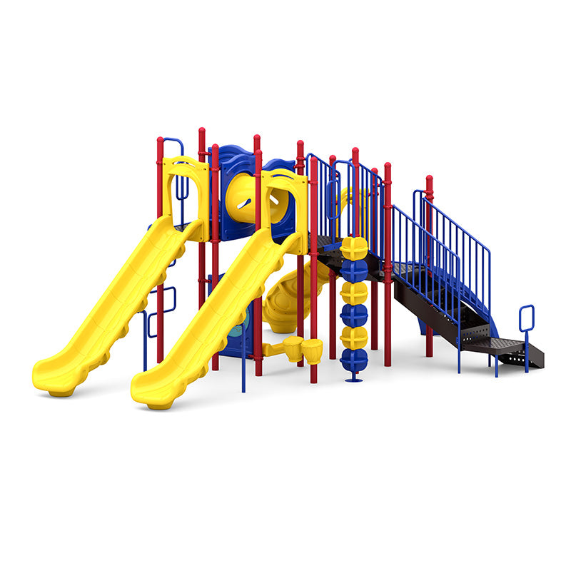 Colorful outdoor playground with dual yellow slides, blue climbers, red posts, interactive panels, and accessible transfer station.