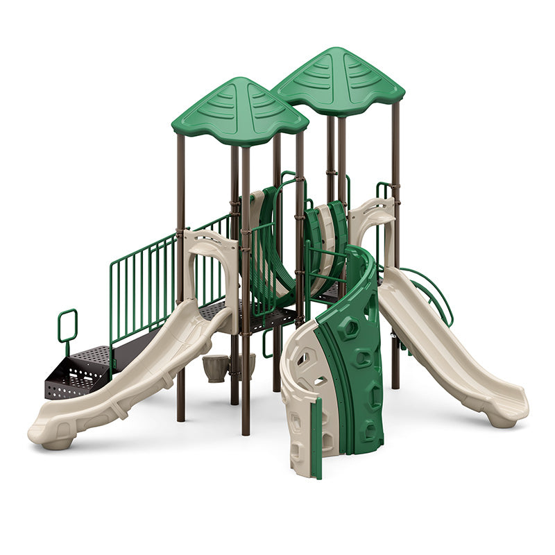 Playground structure with two green roofs, curved climbing wall, beige slides, and connecting bridge with railings
