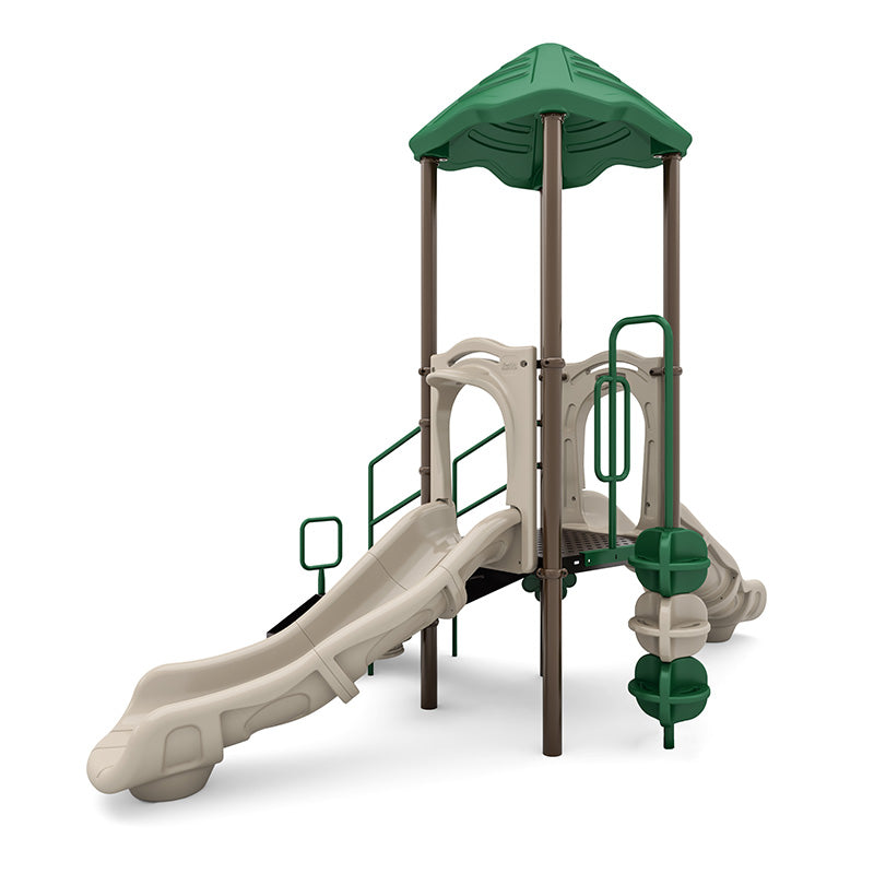 Compact playground with green leaf-shaped roof, beige slides, pod climber, accessible transfer station, and musical play elements.