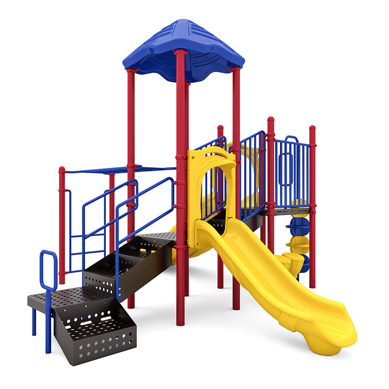Colorful playground structure with yellow double slide, red posts, blue railings, stairs, blue canopy roof, and sensory play elements.