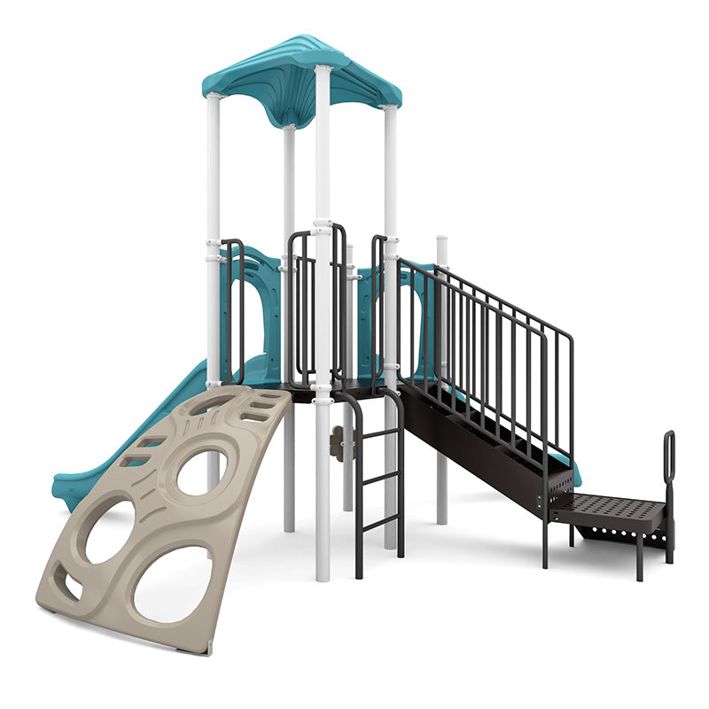 Playground structure with teal canopy, beige climbing wall with circular cutouts, black ramp with handrails, and slide