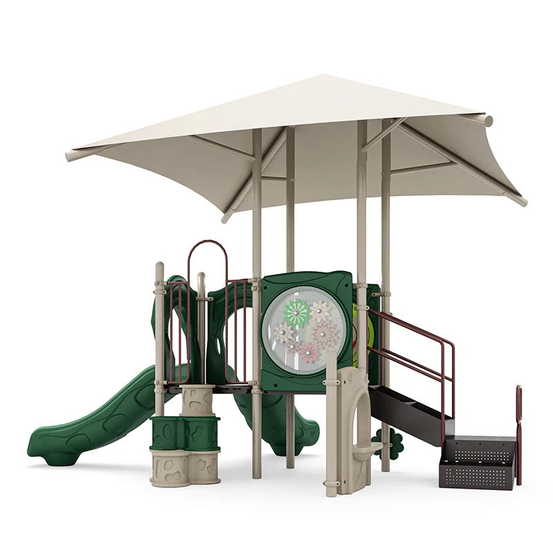 Playground structure with neutral shade roof, two green slides, gear panel, stairs, and ADA transfer station