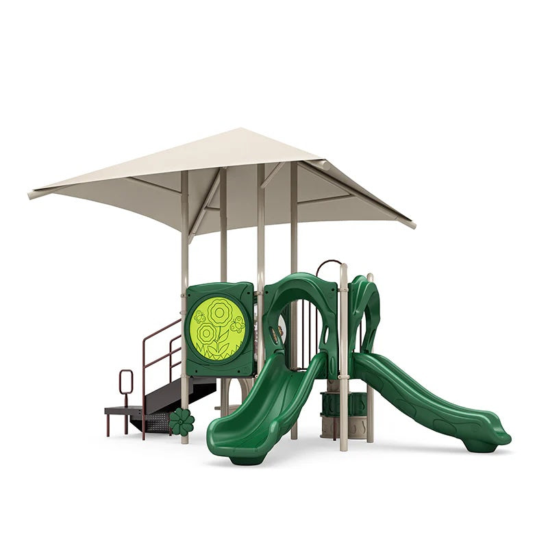 Green playground structure with two straight slides, shaded canopy, climbing stairs, ADA transfer station, and interactive panels for young children