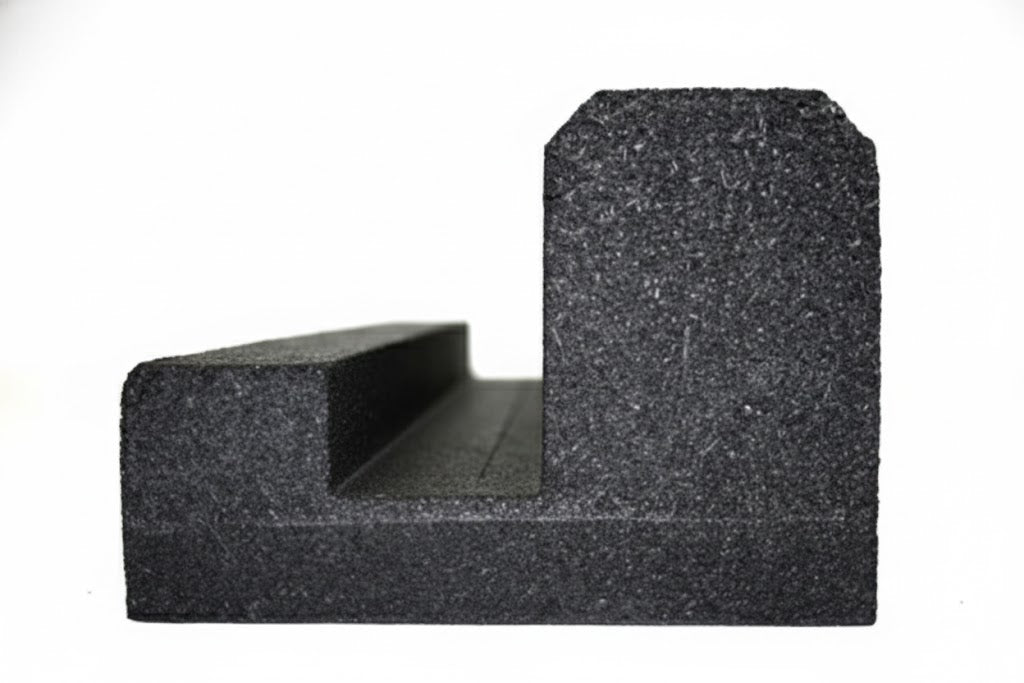 Black molded recycled rubber J-Curb with key-way channel for securing loose fill and turf containment, flexible playground border