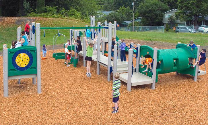 Kids Playing on Large School Playground with Rubber Mulch