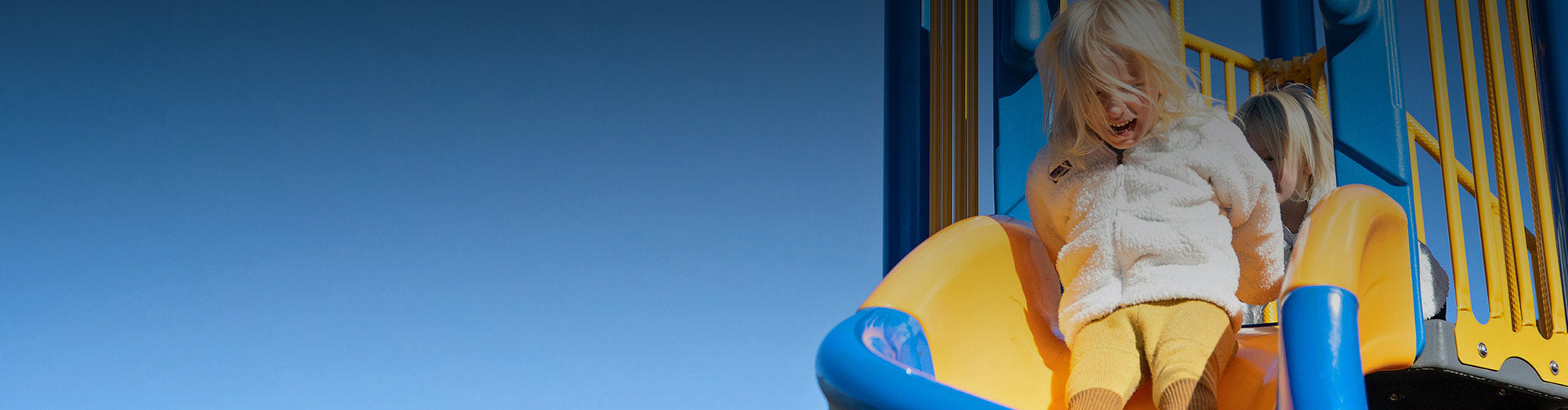 Girl Sliding on Playground slide & Playground Equipment