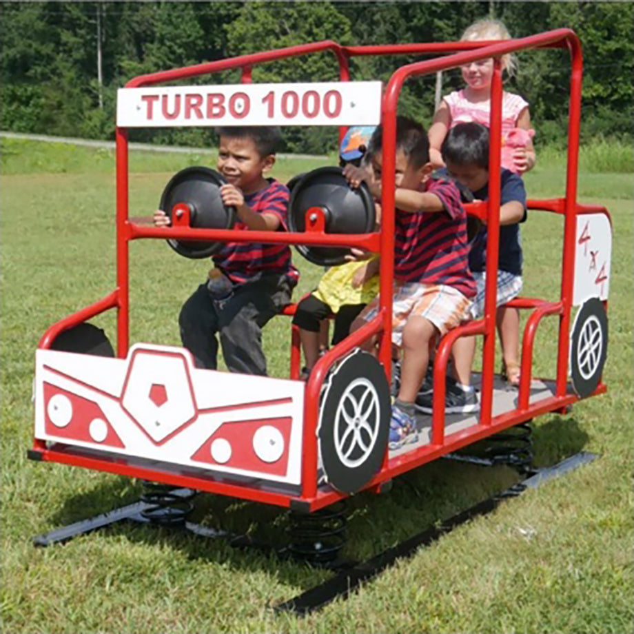 Turbo 1000 Rayzir Multi Passenger Spring Rider with red frame and black steering wheels, children playing outdoors on grass
