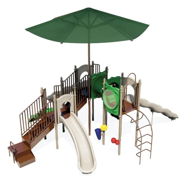 Natural-colored playground with two wave slides, vertical ladder, tunnel, and large green shade canopy overhead