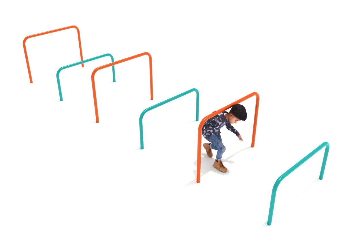 Child navigating colorful steel agility hurdles in a playground fitness course for jumping and ducking activities