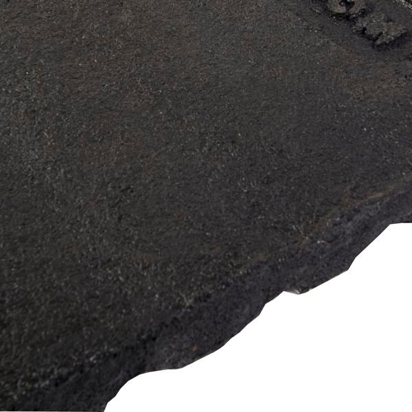 Textured black rubber playground safety mat with beveled edge for impact absorption and slip resistance under swings or slides