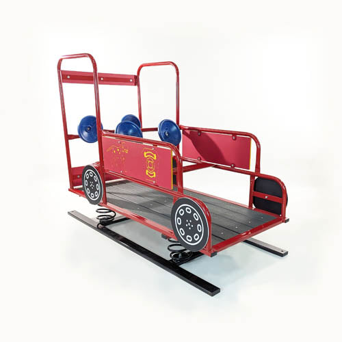 Red fire truck-shaped spring rider with blue steering wheels, black deck floor, and two pretend fire hoses.