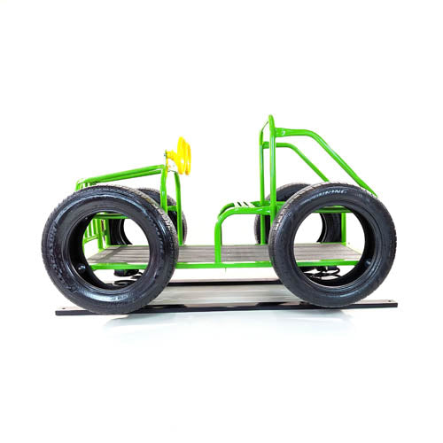 Green metal spring rider shaped like a jeep with black tires and two yellow plastic steering wheels