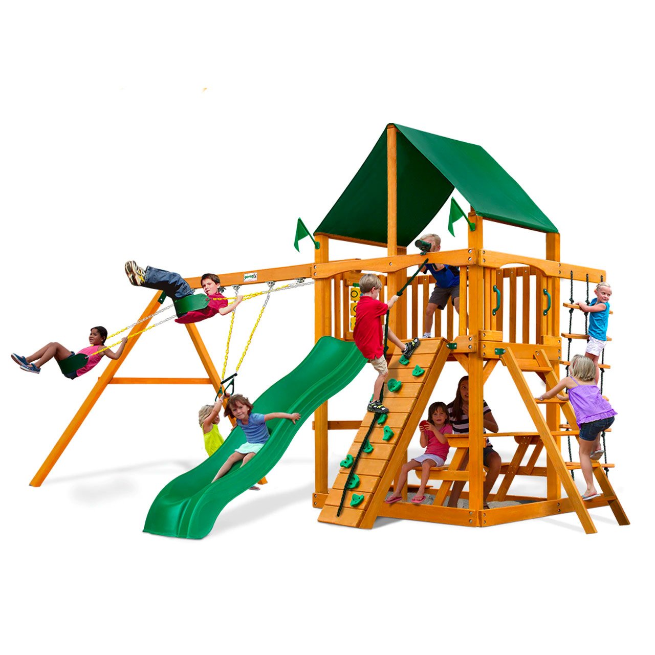 Wooden playset with green canopy, wave slide, rock climbing wall, swings, and picnic table with children playing