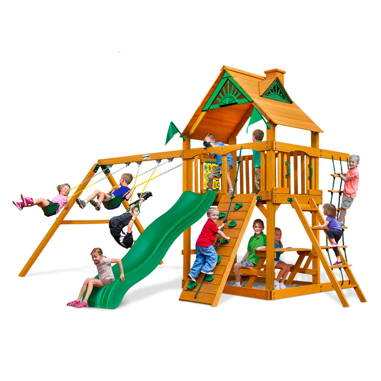 Chateau AP Wooden Swing Set with natural cedar wood, green wave slide, rock wall, swings, picnic table, and climbing ropes in backyard setting