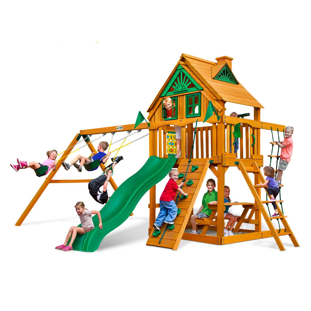 Wooden playset with green wave slide, swings, rock climbing wall, tic-tac-toe panel, and built-in picnic table with children playing