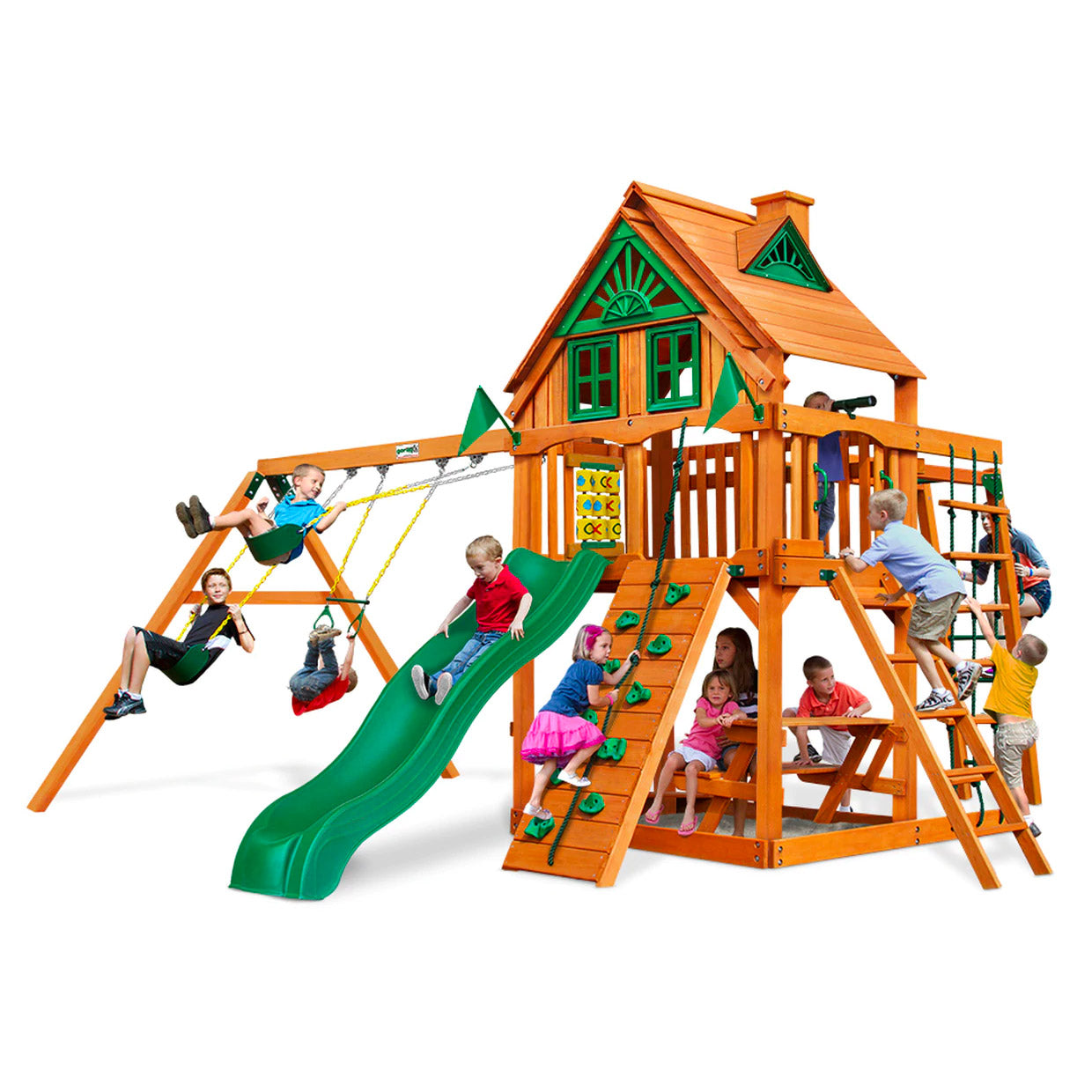 Amber-stained wooden playset with green slide, swings, rock climbing wall, picnic table, and children playing